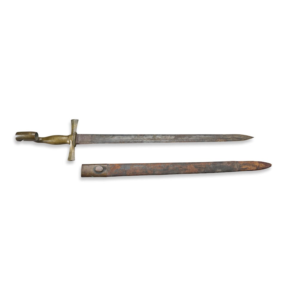 A U.S. HORSTMANN & SONS SWORD BAYONET AND SCABBARD,: A U.S. HORSTMANN & SONS SWORD BAYONET AND SCABBARD, W.H. Horstmann & Sons, Philadelphia, c. 1835. Smooth brass handle with offset socket, straight single-edge blade with false edge at the tip and sing