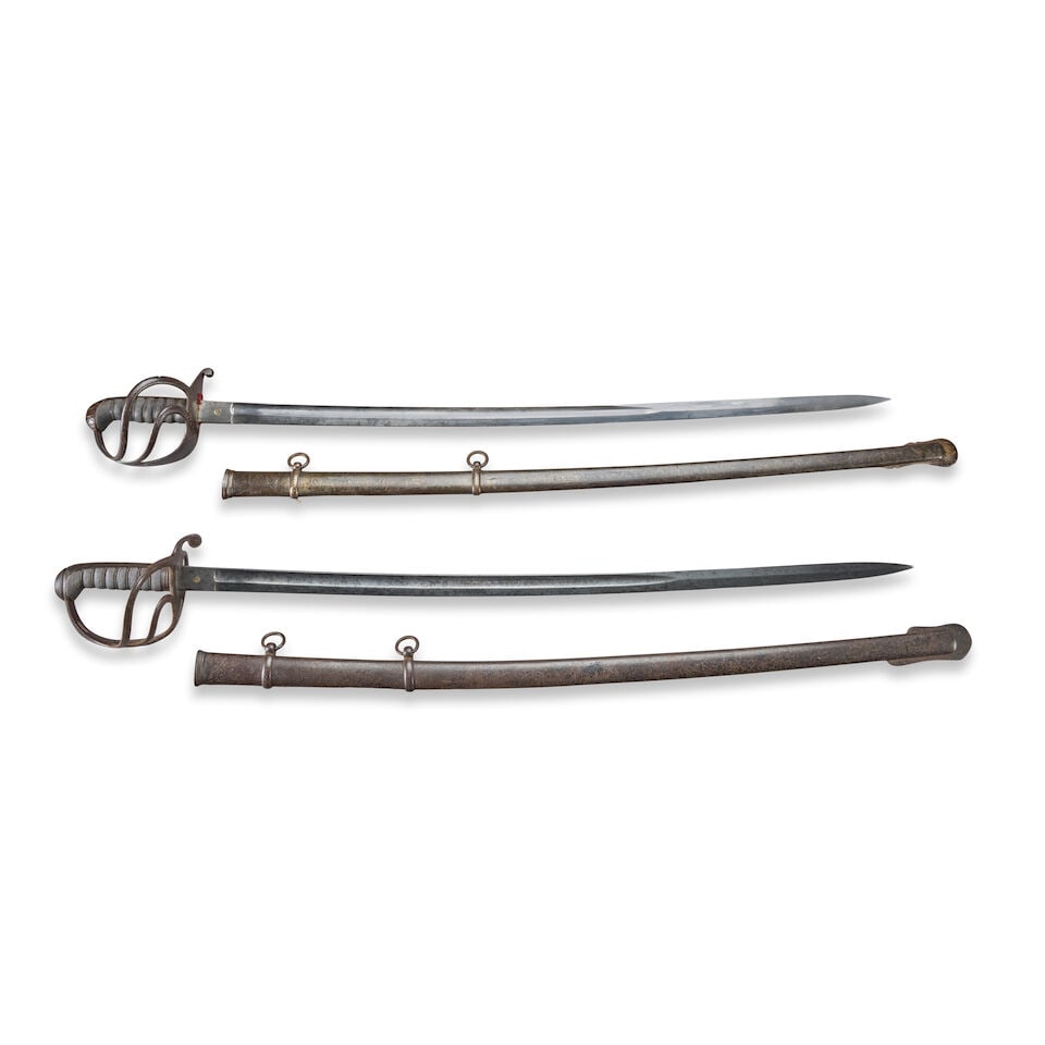 TWO MID-19TH CENTURY WALSCHEID CAVALRY SABERS.: TWO MID-19TH CENTURY WALSCHEID CAVALRY SABERS. An iron hilted British Model 1824-style saber with two branch iron hilt, stepped pommel cap and back strap, ray skin covered grip with twisted copper wir