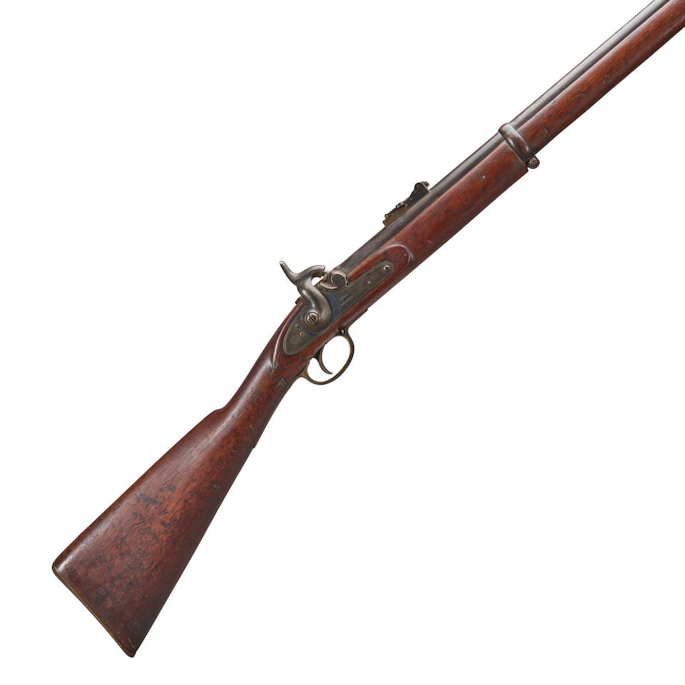 A CIVIL WAR BRITISH PATTERN 1853 RIFLE MUSKET,: A CIVIL WAR BRITISH PATTERN 1853 RIFLE MUSKET, 1861. 39 in., .58 caliber, barrel with adjustable rear sight and numerous proof and inspector's marks at the breech; flat lock plate with double line bor