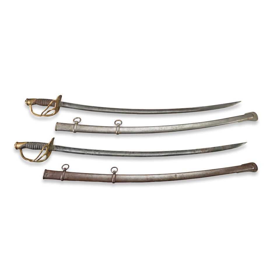 TWO CIVIL WAR MODEL 1860 LIGHT CAVALRY SABERS.: TWO CIVIL WAR MODEL 1860 LIGHT CAVALRY SABERS. A saber by Emerson & Silver, with a brass hilt with solid counter-guard having two branches that connect to the knuckle bow which is secured at the base 