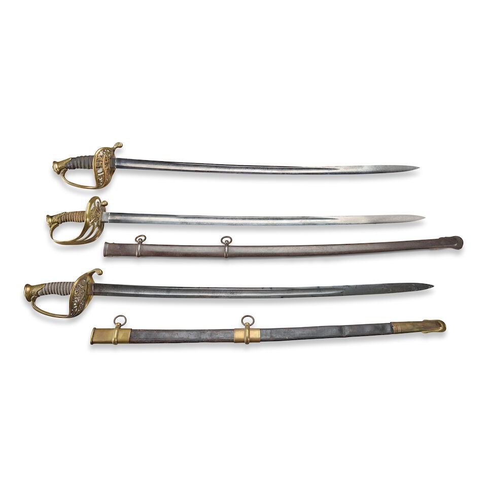 THREE CIVIL WAR STAFF AND FIELD/NON-COMMISSIONED OFFICER'S SWORDS.: THREE CIVIL WAR STAFF AND FIELD/NON-COMMISSIONED OFFICER'S SWORDS. A Non-Regulation U.S. Model 1850 Foot Officer's Sword with brass openwork foliate scroll guard and down turned quillon, pommel cap wi