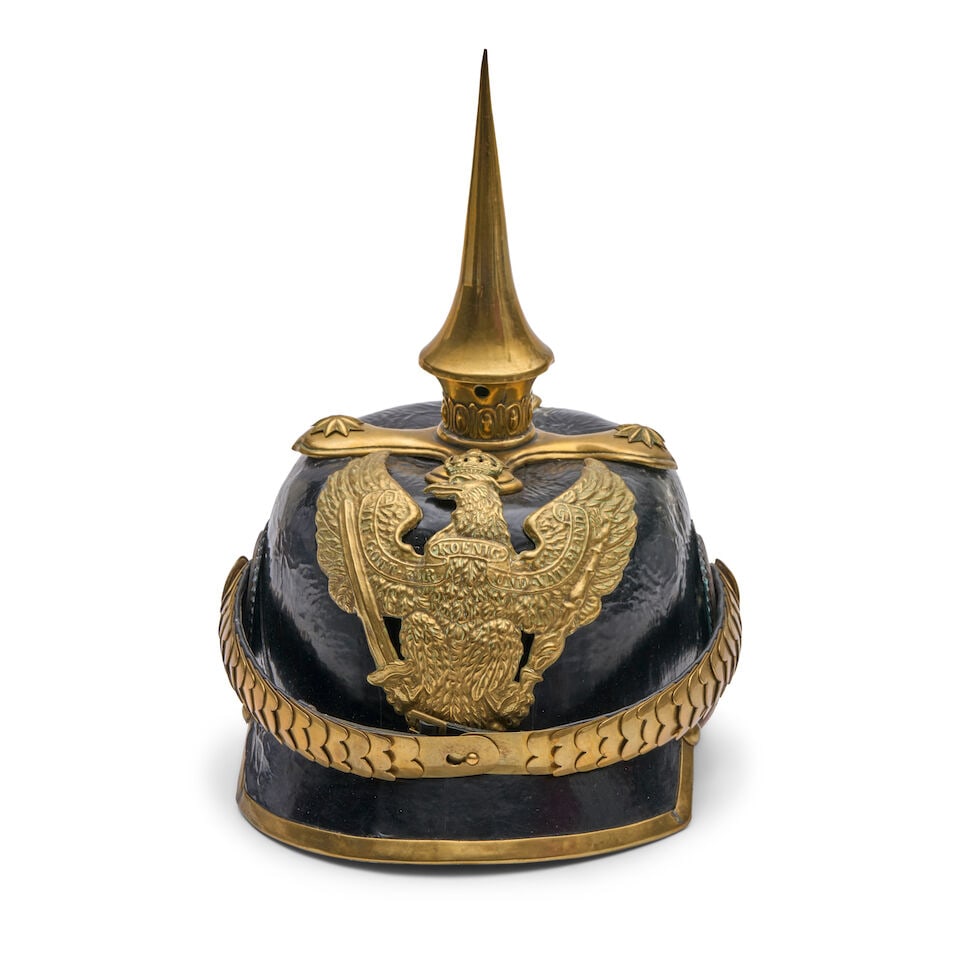 AN IMPERIAL GERMAN DRAGOON OFFICER'S PICKELHAUBE HELMET.: AN IMPERIAL GERMAN DRAGOON OFFICER'S PICKELHAUBE HELMET. With brass spike on a cruciform base, spine without a vent, brass scale chin strap and front plate; cloth liner and leather sweat band, square 