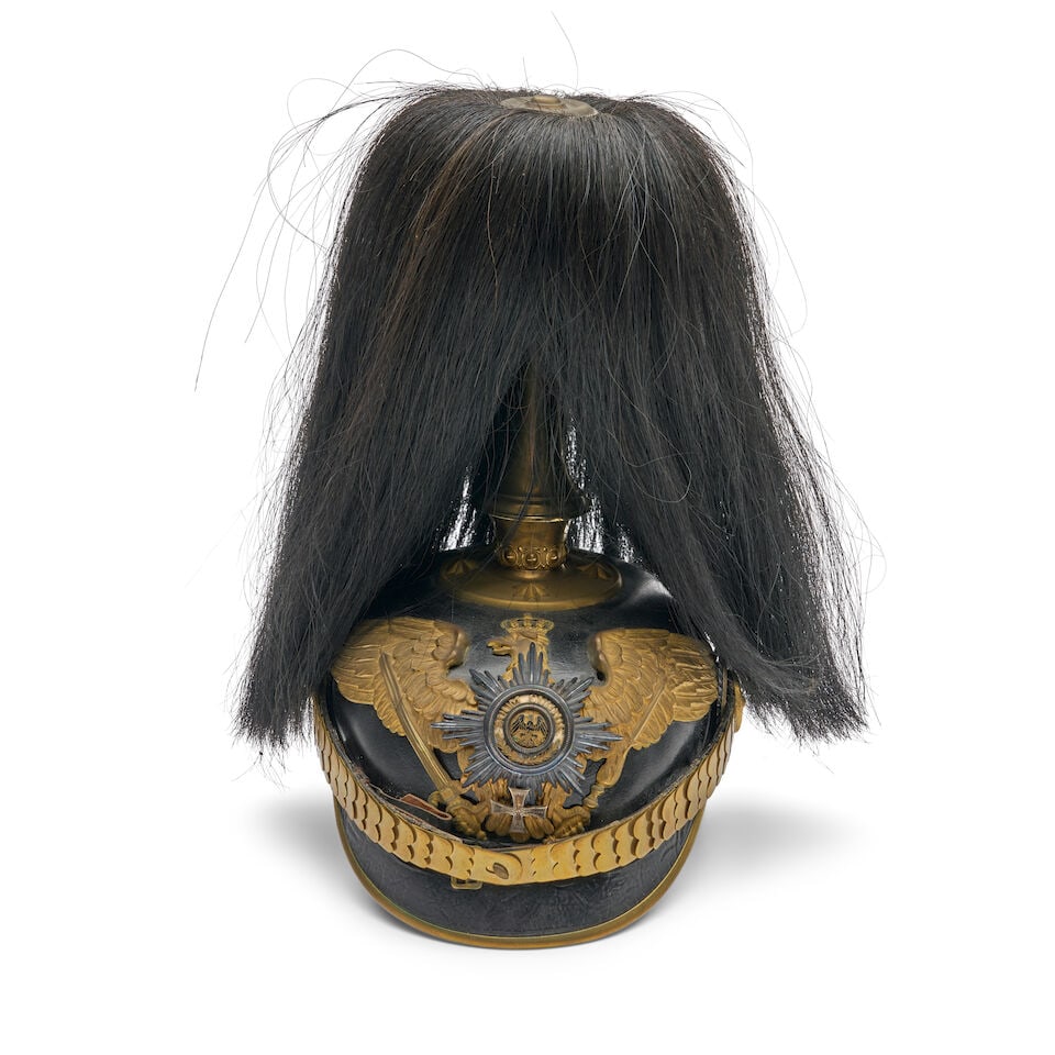 AN IMPERIAL GERMAN GUARDE OFFICER'S PICKELHAUBE HELMET WITH PARADE PLUME.: AN IMPERIAL GERMAN GUARDE OFFICER'S PICKELHAUBE HELMET WITH PARADE PLUME. With black horse hair, spine without a vent, brass scale chin strap and front plate with applied badge; cloth liner and leathe