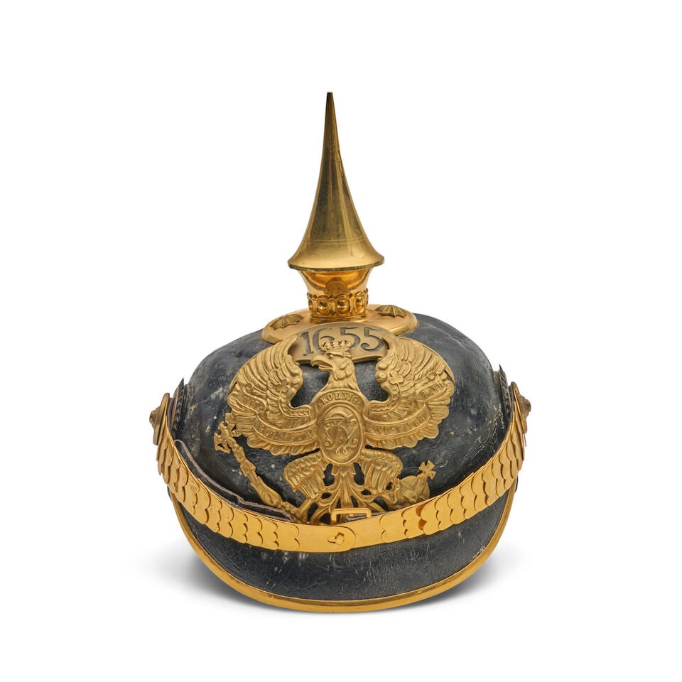 AN IMPERIAL GERMAN OFFICER'S PICKEHAUBE HELMET.: AN IMPERIAL GERMAN OFFICER'S PICKEHAUBE HELMET. With brass spike, spine without a vent, brass scale chin strap and front plate with '1655' banner; leather sweat band (likely some restoration). For fur