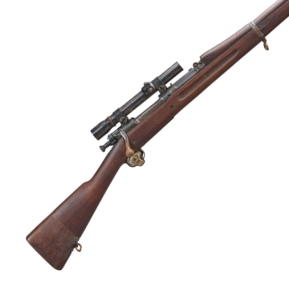 A WORLD WAR I SPRINGFIELD U.S. MODEL 1903 BOLT ACTION RIFLE, Curio or Relic firearm: A WORLD WAR I SPRINGFIELD U.S. MODEL 1903 BOLT ACTION RIFLE, 1915. Serial number 607981, .30-06 caliber, barrel dated 3-15, stock with legible cartouches; fitted with a Weaver K 2.5 scope. Barrel lg. 