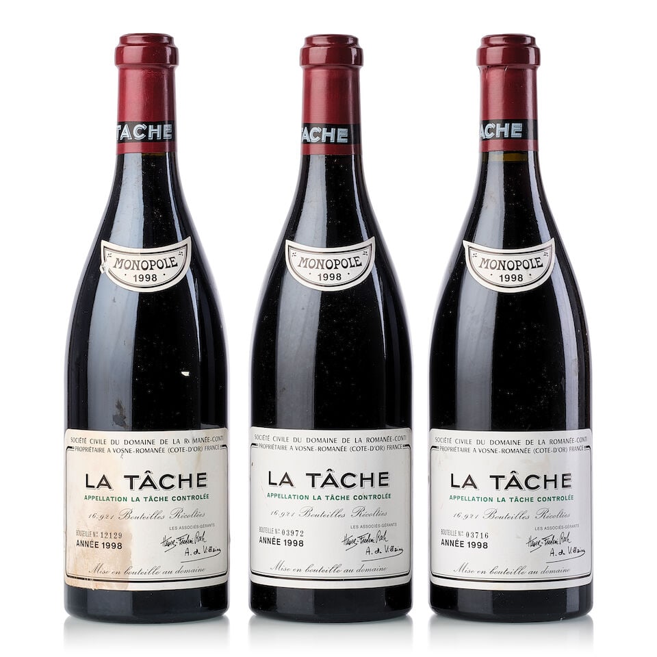 Domaine de la Romanée-Conti La Tâche, 1998 (3x 750ml): Domaine de la Romanée-Conti La Tâche, 1998 (3x 750ml) Region: Burgundy Fill Level: 3x 0.5cm Label: 2x slightly marked, 1x slightly stained, 1x heavily damp-stained, 1x scuffed neck tag, 1x s