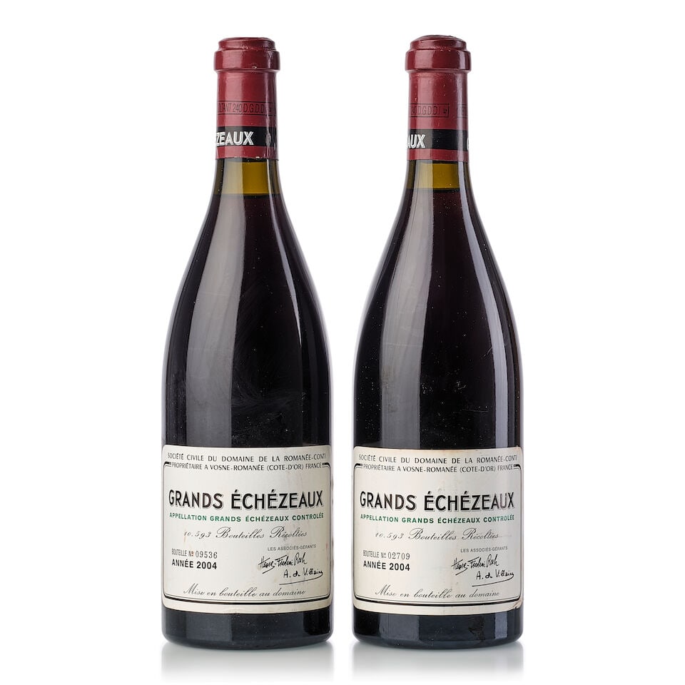 Domaine de la Romanée-Conti Grands Echézeaux, 2004 (2x 750ml): Domaine de la Romanée-Conti Grands Echézeaux, 2004 (2x 750ml) Region: Burgundy Capsule: 1x slightly oxidised Cork: 1x protruded, 1x signs of old seepage Label: 1x slightly stained, 2x scuffe