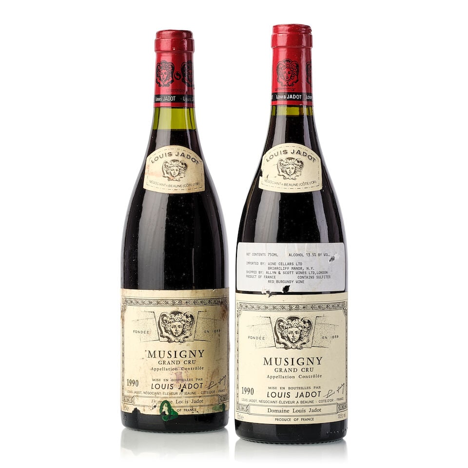 Louis Jadot Musigny, 1990 (2x 750ml): Louis Jadot Musigny, 1990 (2x 750ml) Region: Burgundy Fill Level: 1x 0.5cm, 1x 1.5cm Capsule: slightly scuffed Cork: slightly depressed Label: 1x slightly torn, 1x nicked label and vintage tag, 1x dam