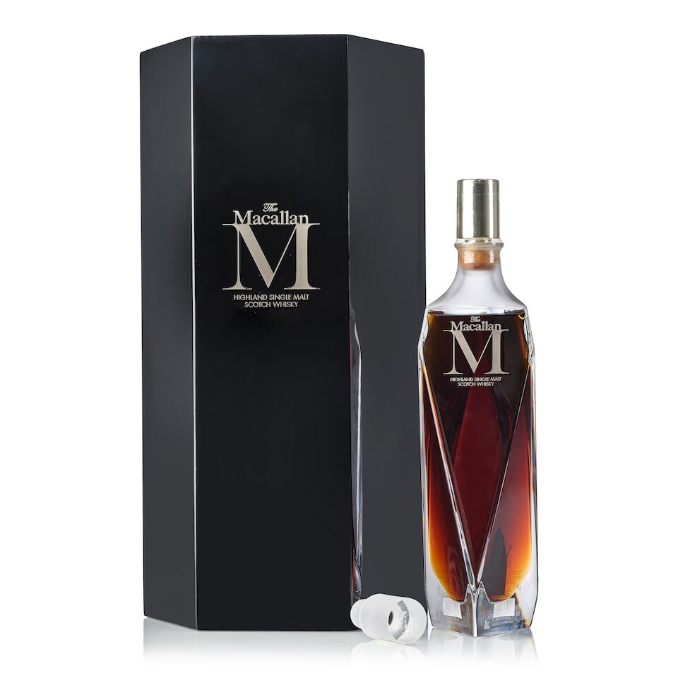The Macallan M Decanter, NV (1x 700ml): The Macallan M Decanter, NV (1x 700ml) Region: Speyside Capsule: stained capsule Label: transfer print label Packaging: original presentation case with crystal stopper Miscellaneous: label taped and t