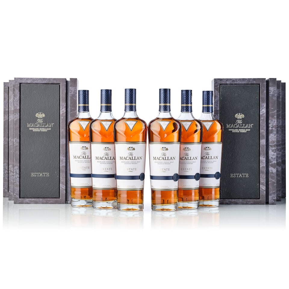 The Macallan Estate, NV (6x 700ml): The Macallan Estate, NV (6x 700ml) Region: Speyside Label: 5x good labels, 1x slightly stained back label Packaging: 5x original cases, 1x scuffed original case Miscellaneous: 2x original outer carton