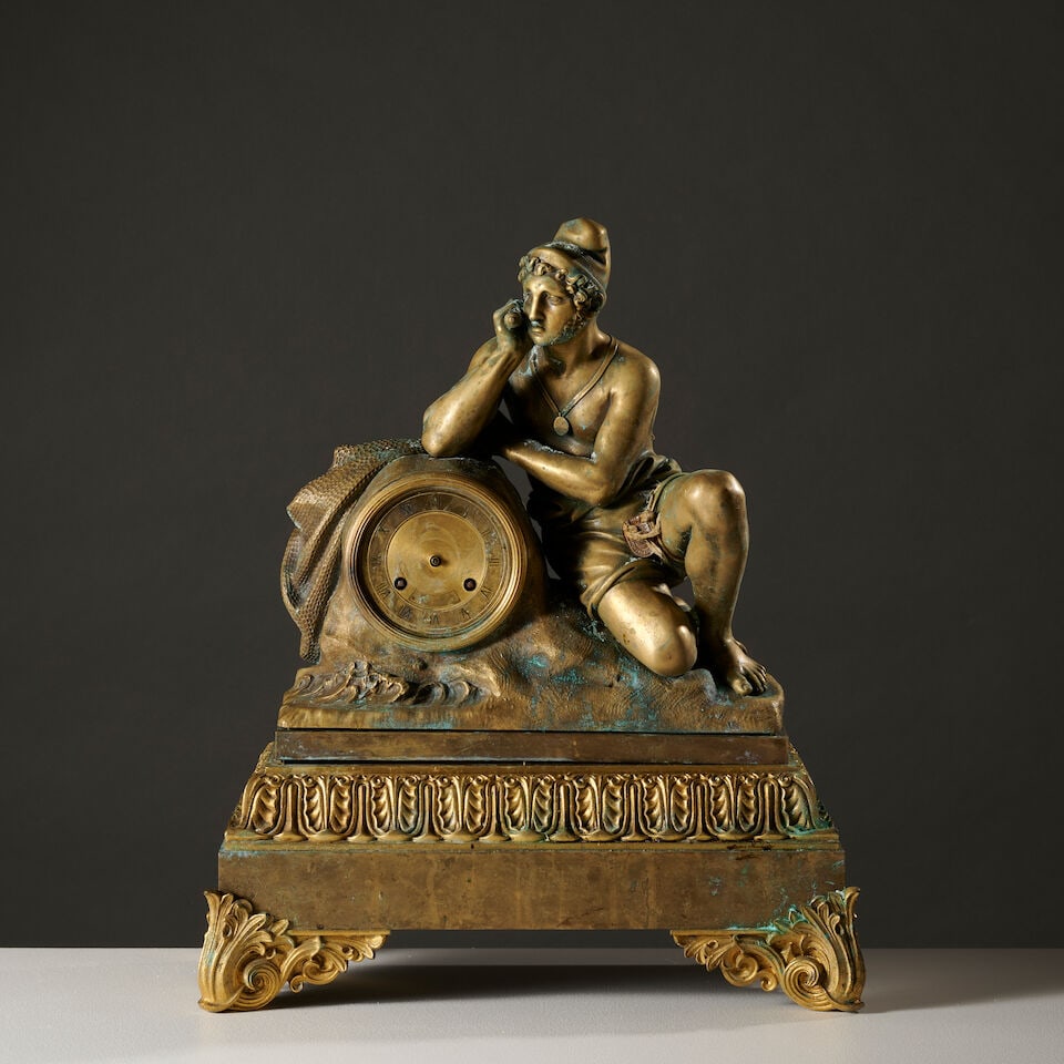 Pendule en bronze figurant un pêcheur napolitain vers 1840 A gilt-bronze mantel clock depic...: Pendule en bronze figurant un pêcheur napolitain vers 1840 A gilt-bronze mantel clock depicting a Neapolitan fisherman circa 1840 Le pécheur est accoudé à un rocher sur lequel un