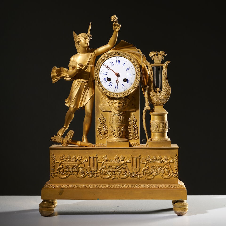 Pendule en bronze doré et ciselé figurant l'Amour d'époque Restauration A gilt-br...: Pendule en bronze doré et ciselé figurant l'Amour d'époque Restauration A gilt-bronze clock depicting Eros, first half of the 19th century Le mouvement et le cadran émaillé