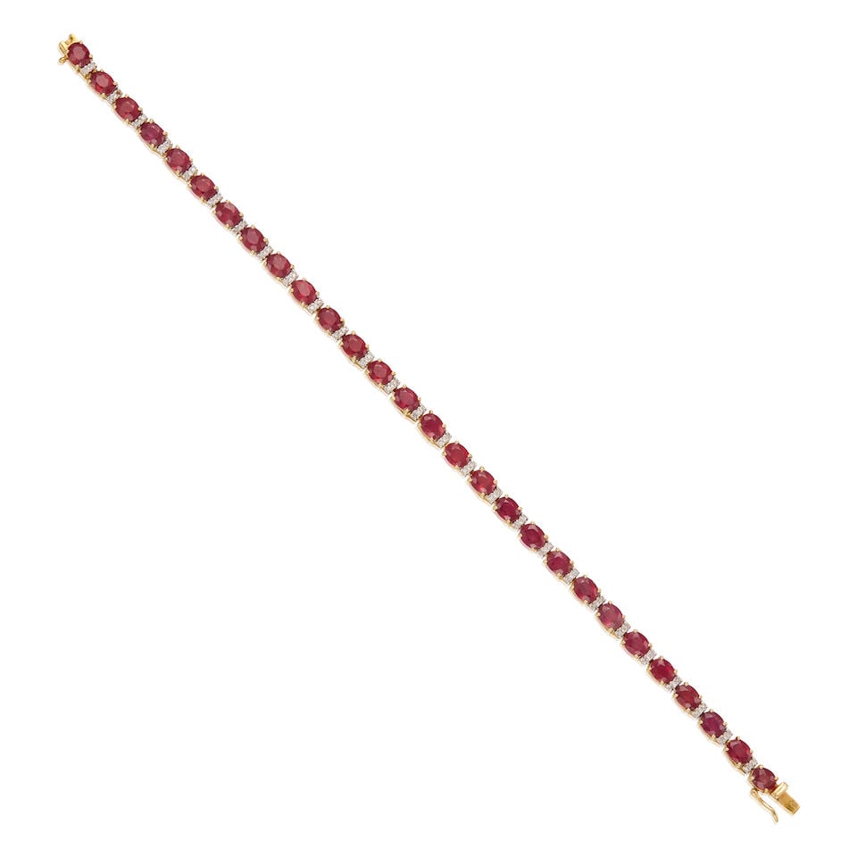 14K YELLOW GOLD, RUBY, AND DIAMOND BRACELET: 14K YELLOW GOLD, RUBY, AND DIAMOND BRACELET • Numerous oval shaped rubies weighing approximately 7 carats total • Numerous round shaped melee diamonds • Length 7 3/4 in. •