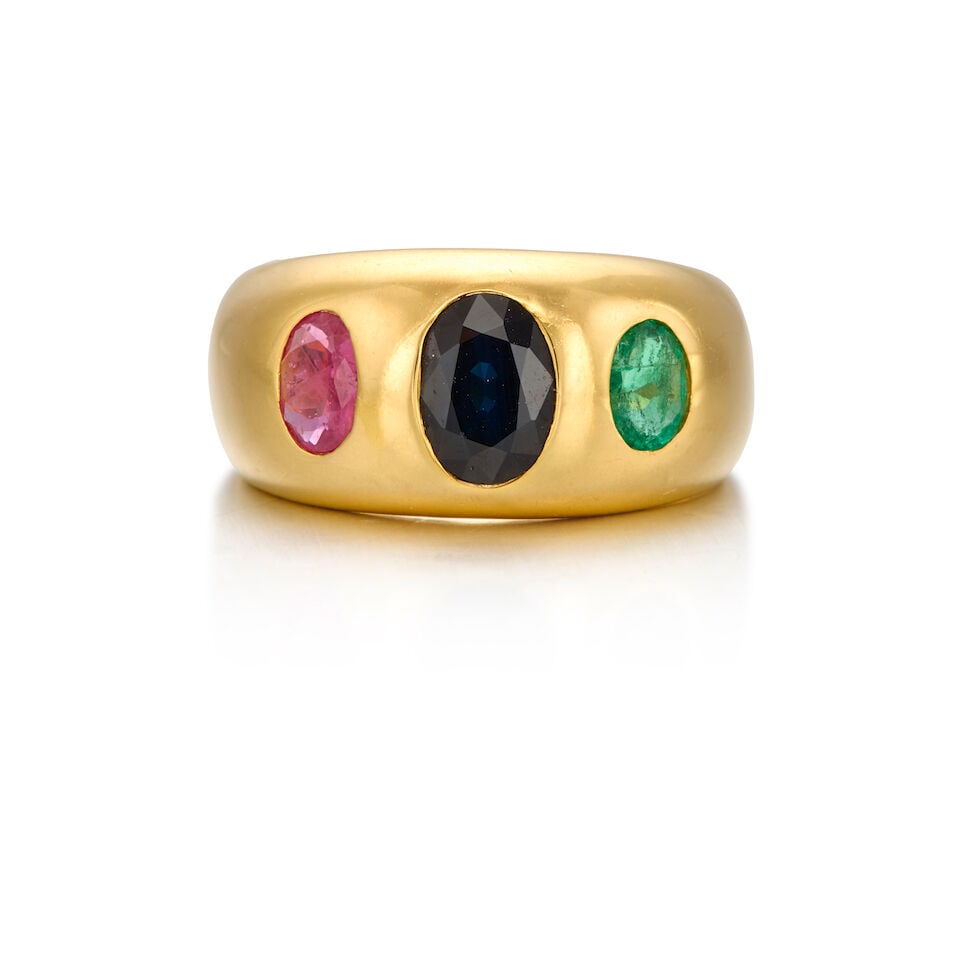 18K GOLD, SAPPHIRE, RUBY AND EMERALD RING: 18K GOLD, SAPPHIRE, RUBY AND EMERALD RING • One oval shaped sapphire weighing approximately 1.15 carats • One oval shaped ruby weighing approximately 0.33 carat • One oval shaped