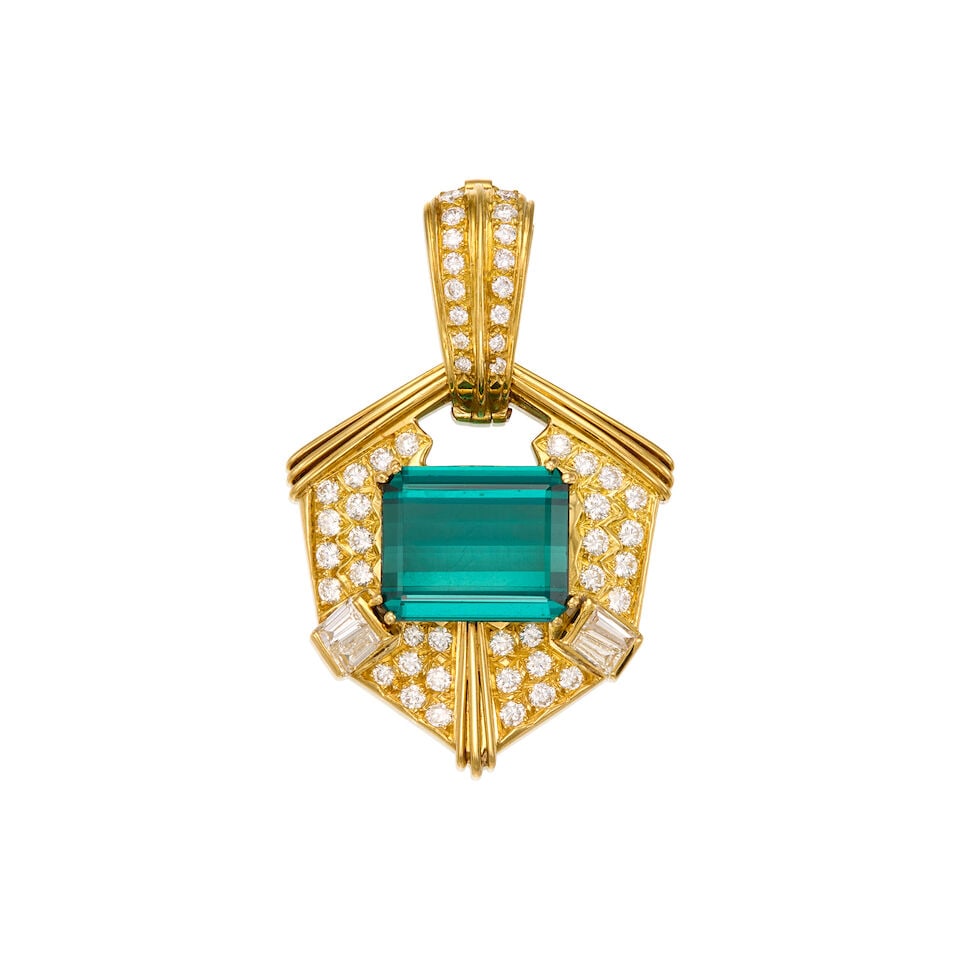 18K YELLOW GOLD, TOURMALINE, AND DIAMOND PENDANT: 18K YELLOW GOLD, TOURMALINE, AND DIAMOND PENDANT • A rectangular shaped tourmaline weighing approximately 8.50 carats total • Numerous round shaped diamonds weighing approximately 1 carat 