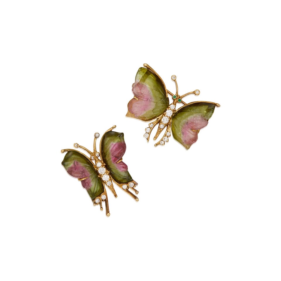 14K YELLOW GOLD, TOURMALINE, AND DIAMOND BROOCHES: 14K YELLOW GOLD, TOURMALINE, AND DIAMOND BROOCHES • A 14K yellow gold brooch with two carved tourmalines measuring approximately 16.84mm x 11.78mm x 2.66mm, with twelve round shaped diamonds