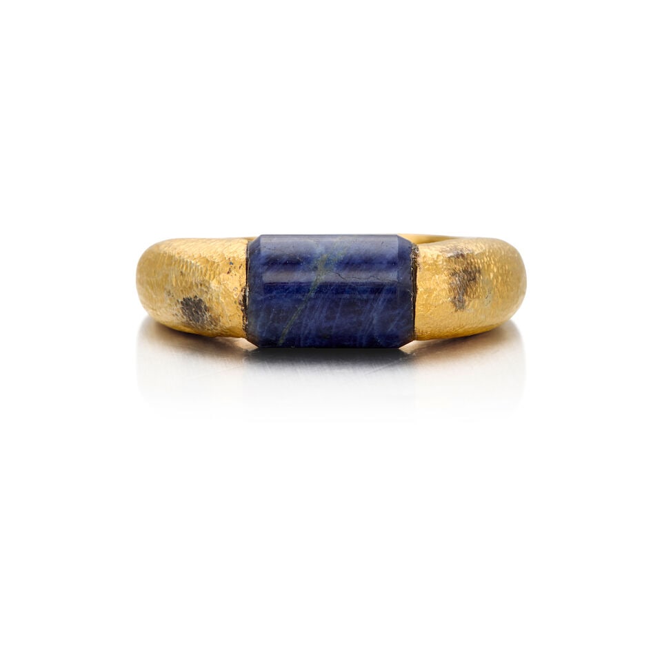 LALAOUNIS: 22K GOLD AND SODALITE RING: LALAOUNIS: 22K GOLD AND SODALITE RING • One carved sodalite measuring approximately 9.38mm x 6.55mm • Size 4 1/2 • Estimated gross weight: 6.80 grams Footnotes: OVERALL CONDITION: