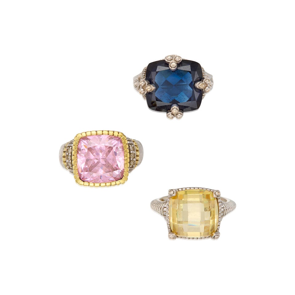 A GROUP OF JUDITH RIPKA JEWELRY: A GROUP OF JUDITH RIPKA JEWELRY • A sterling silver ring with one square shaped synthetic sapphire, size 6 • A sterling silver ring with one cushion synthetic stone, size 5 1/2 • A