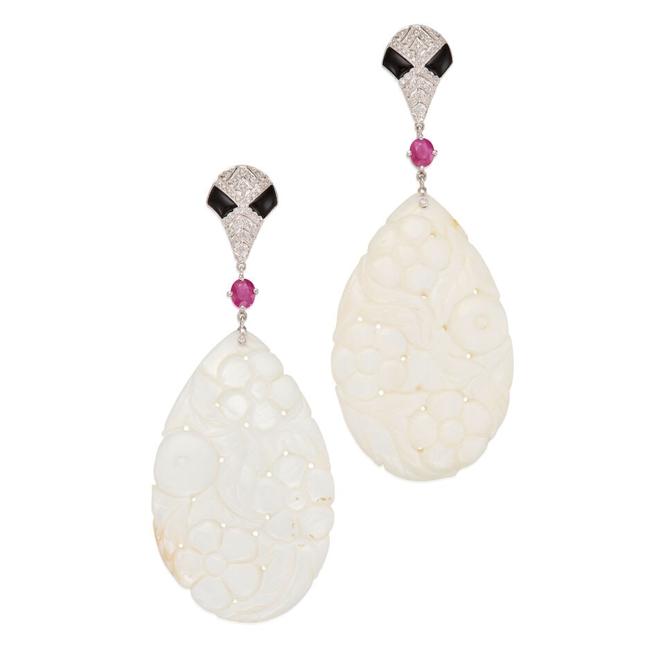 18K WHITE GOLD, MOTHER OF PEARL, RUBY, ONYX, AND DIAMOND EARRINGS: 18K WHITE GOLD, MOTHER OF PEARL, RUBY, ONYX, AND DIAMOND EARRINGS • Two carved and pear-shaped mother of pearl measuring approximately 58.00mm x 34.50mm x3.37mm • Two oval shaped rubies