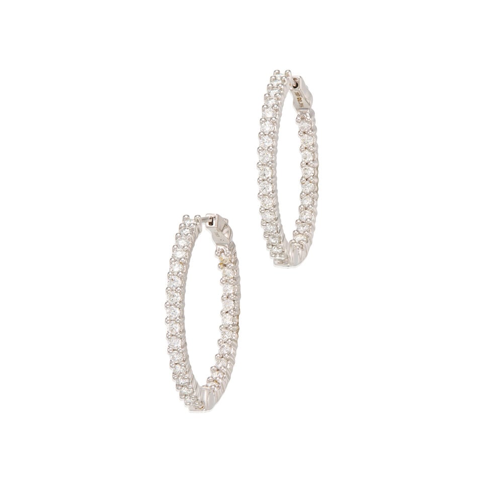 18K WHITE GOLD AND DIAMOND EARRINGS: 18K WHITE GOLD AND DIAMOND EARRINGS • Numerous round shaped diamonds weighing approximately 2 carats total • Measures 1 1/4 in. x 1/8 in. • Estimated gross weight: 11.7 grams Footnot
