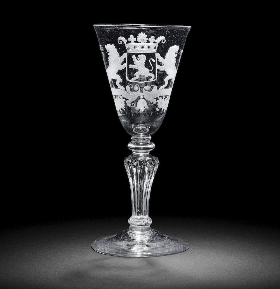 A fine Dutch engraved armorial composite stem goblet, circa 1740-50: A fine Dutch engraved armorial composite stem goblet, circa 1740-50 The generous round funnel bowl decorated with the crowned coat of arms of the province of Holland, flanked by lion supporters, on a 