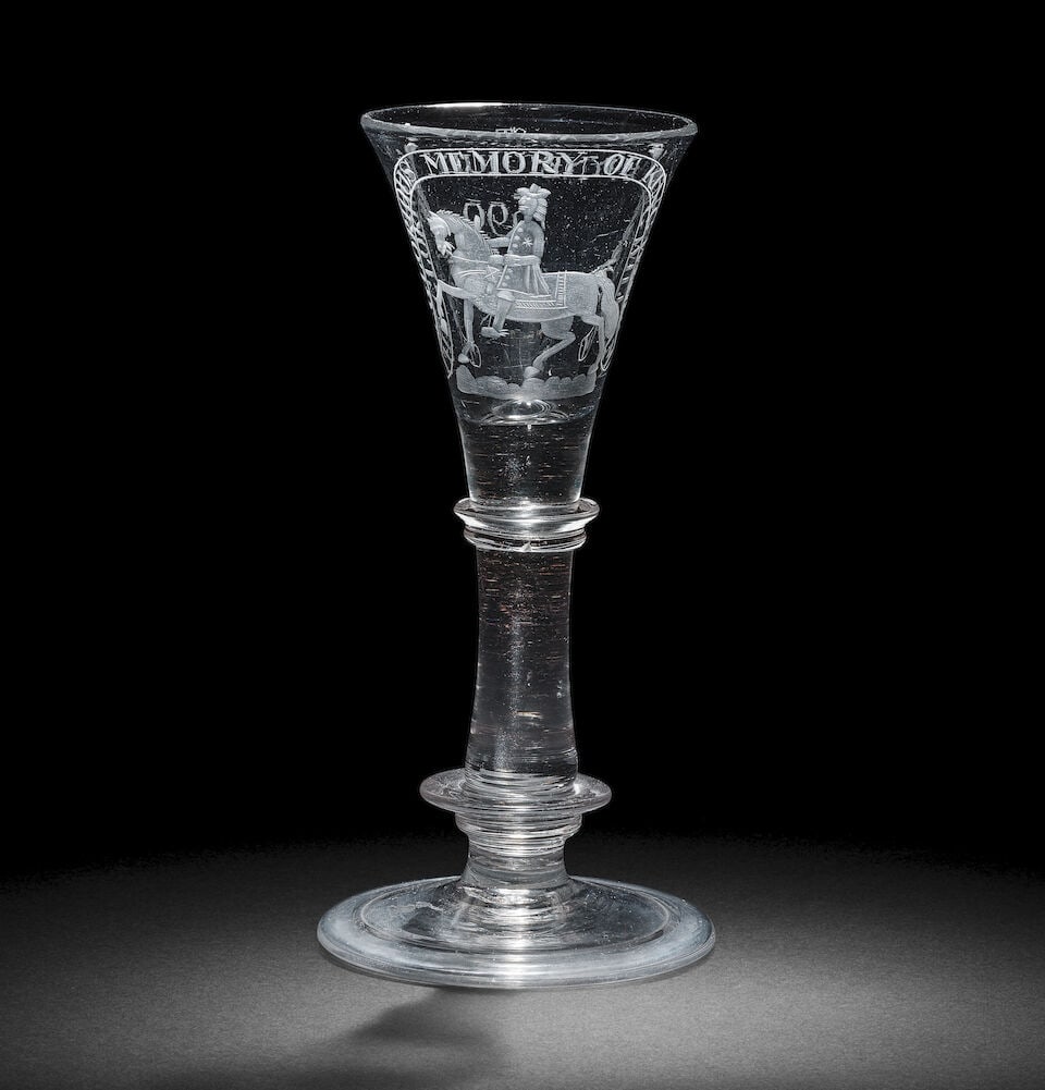 A Williamite engraved commemorative baluster wine glass, mid-18th century or perhaps later: A Williamite engraved commemorative baluster wine glass, mid-18th century or perhaps later Probably Irish, the drawn trumpet bowl with a solid base, decorated with an equestrian portrait of the King, 