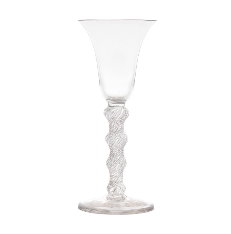 A rare four-knopped airtwist wine glass, circa 1750: A rare four-knopped airtwist wine glass, circa 1750 The bell bowl set on a multi-spiral airtwist stem with four evenly spaced knops of graduated size, over a conical foot, 17.8cm