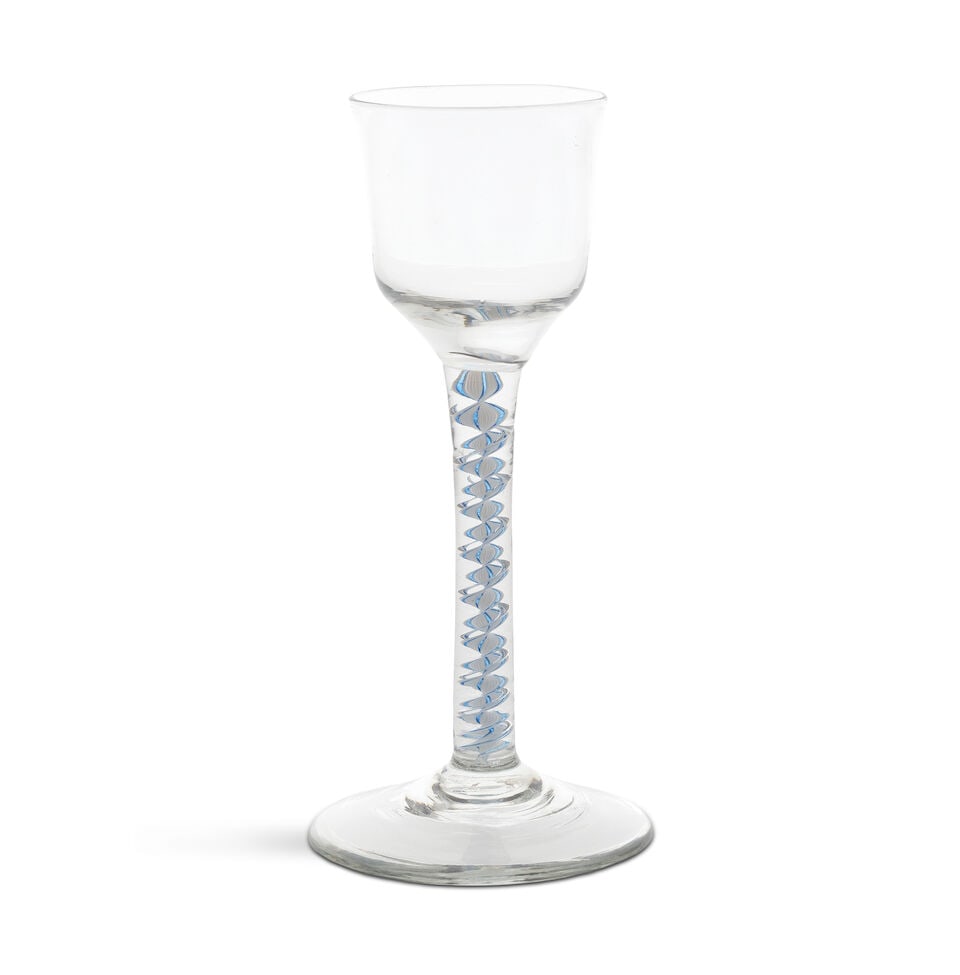 A blue mixed colour twist wine glass, circa 1765: A blue mixed colour twist wine glass, circa 1765 The ogee bowl on a stem containing an opaque white multi-ply corkscrew, with the central and a pair of outer threads in translucent cobalt-blue,