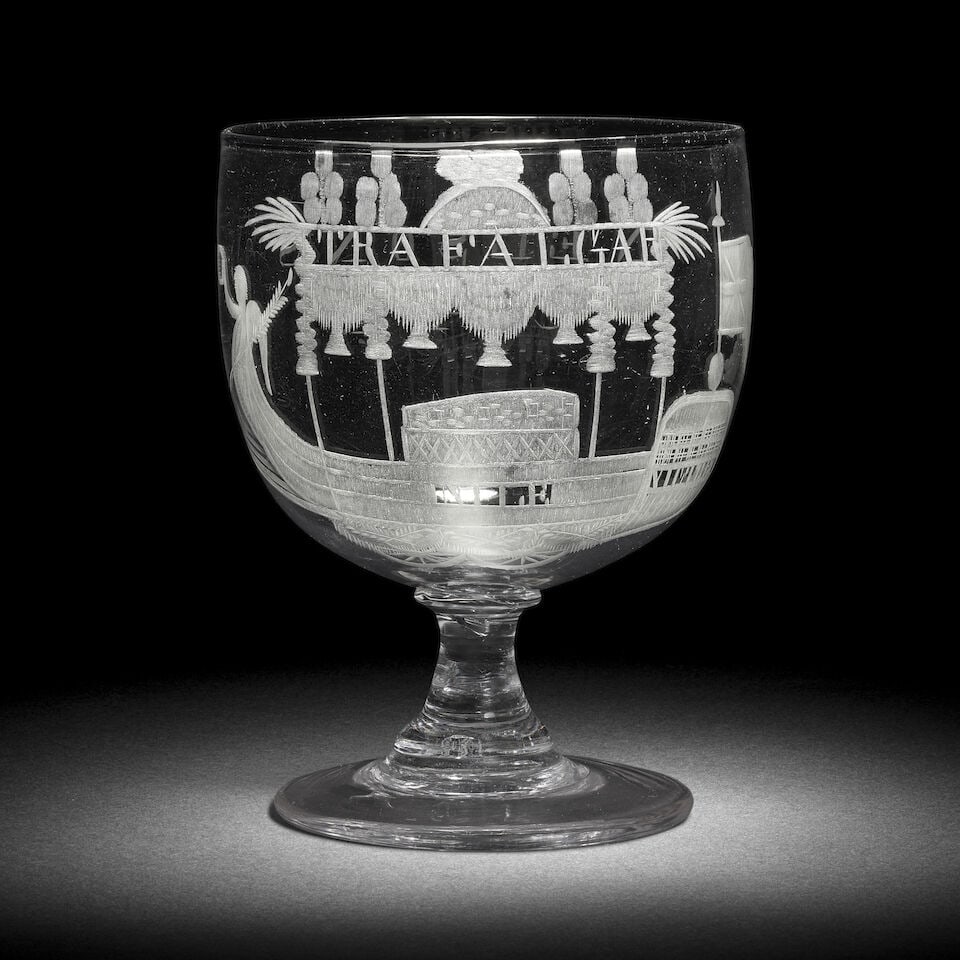 An engraved Nelson commemorative rummer, circa 1806: An engraved Nelson commemorative rummer, circa 1806 The generous ovoid bowl decorated with Nelson's catafalque inscribed 'TRAFALGAR', 'NILE' and 'VICTORY', the reverse inscribed 'NELSONS CAR', on a