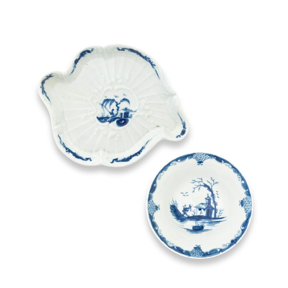 A Worcester teapot stand and a conical bowl, circa 1755-58: A Worcester teapot stand and a conical bowl, circa 1755-58 The stand of unusual strap-fluted rococo form, painted in blue with the 'Fisherman and Willow Pavilion' pattern, 15.2cm wide, the conical