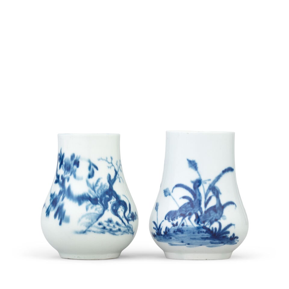 Two Worcester dry mustard pots, circa 1756-65: Two Worcester dry mustard pots, circa 1756-65 Of slender baluster form, painted in blue with the 'Cranes Among Reeds' pattern, the later example with the 'Prunus Root' pattern, 7.7cm and 7.9cm high,