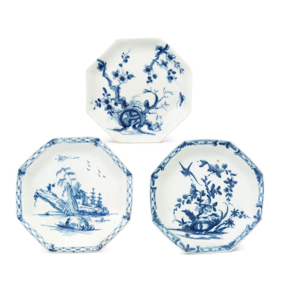 Three Worcester saucers, circa 1755-65: Three Worcester saucers, circa 1755-65 Of octagonal form, painted in blue with the 'Prunus Root', 'Romantic Rocks' and 'Hollow Rock Lily' patterns, 10.5cm - 11.5cm wide, 'Prunus Root' and 'Romantic Ro