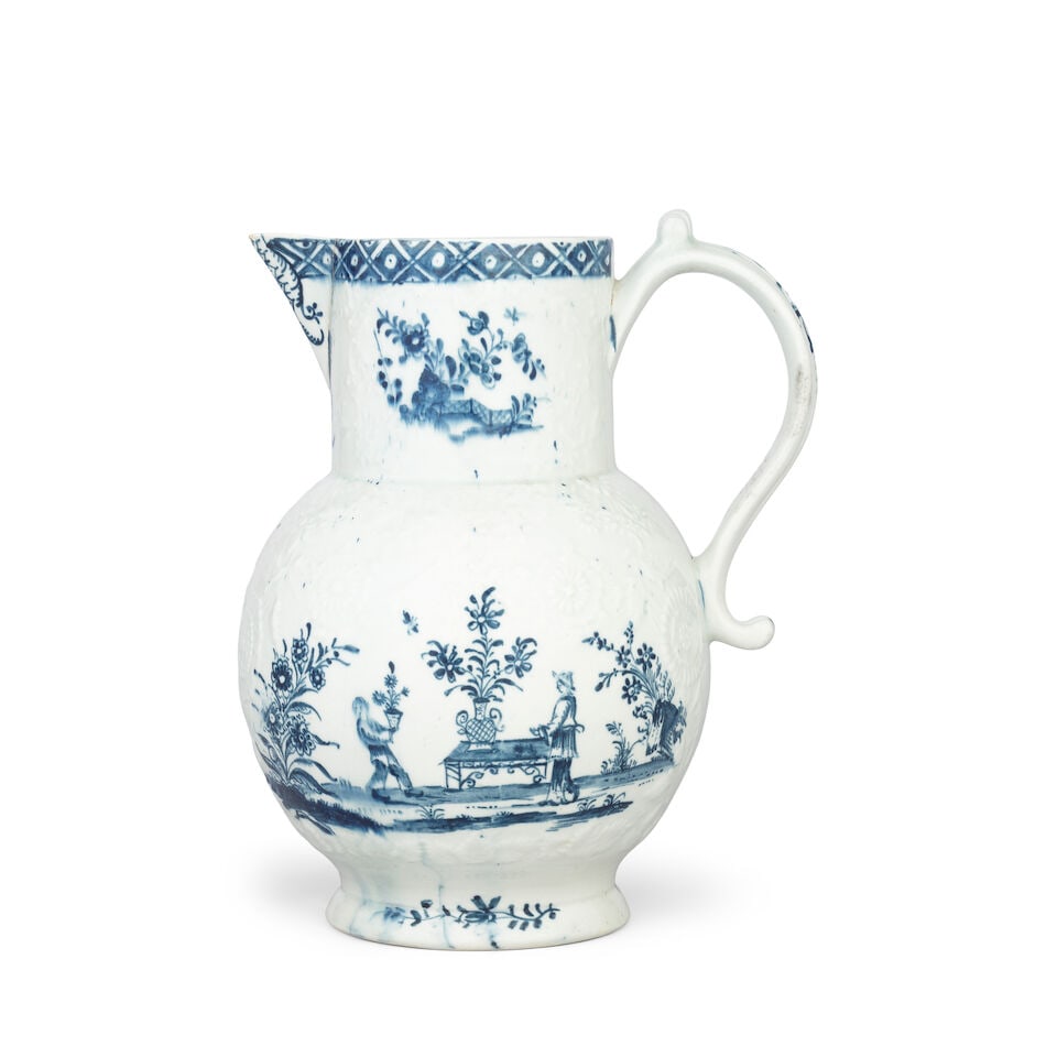 A Lowestoft jug, circa 1765: A Lowestoft jug, circa 1765 Of generous globular form with a cylindrical neck and scrolled handle, moulded in relief with panels edged with scrolls and flowers, painted in blue with two Chinese