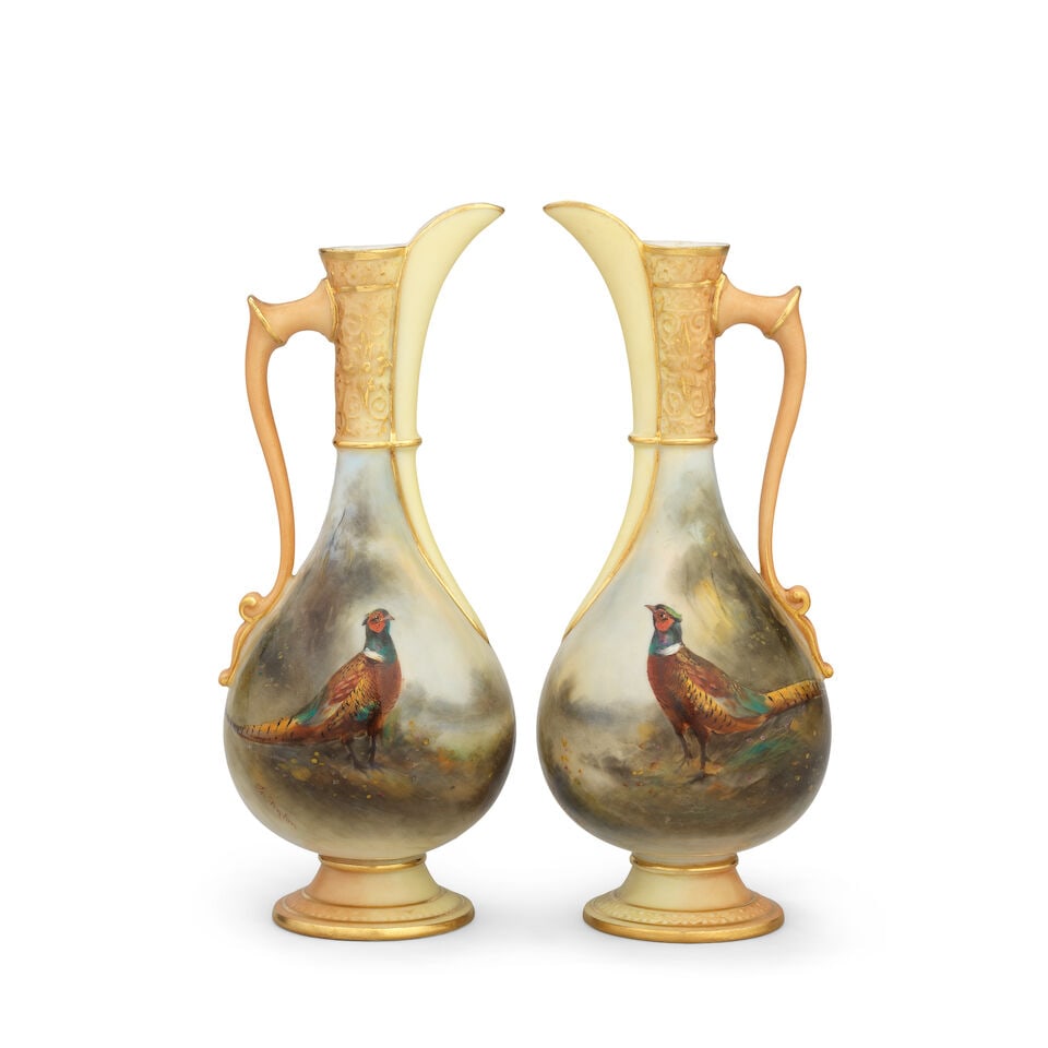 A pair of Royal Worcester ewers by James Stinton, dated 1906: A pair of Royal Worcester ewers by James Stinton, dated 1906 Of Persian form, the slender scrolled handle, moulded neck and foot picked out in blush and gold, both painted with a single cock pheasant 