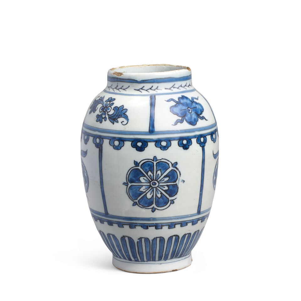 A small Dutch Delft vase, Adrianus Kocks, De Grieksche A, late 17th century: A small Dutch Delft vase, Adrianus Kocks, De Grieksche A, late 17th century Of oval shape painted in blue and outlined in black with a tiled pattern of floral and pomegranate motifs between formal