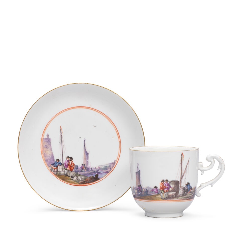 A Meissen cup and saucer, circa 1745: A Meissen cup and saucer, circa 1745 Painted with Kauffahrtei scenes of merchants and their wares at a quayside, the scene on the saucer within two iron-red concentric circles, the cup: 6.8cm high; th