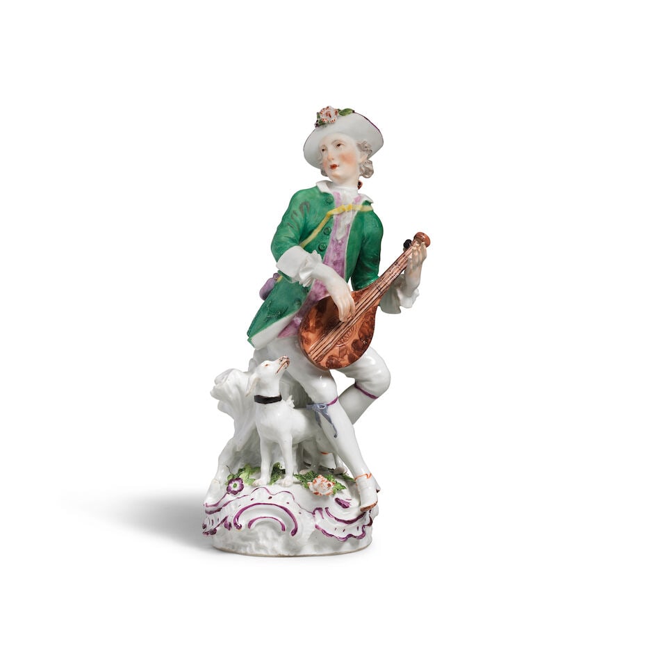 A Meissen figure of lute player, circa 1760: A Meissen figure of lute player, circa 1760 Modelled by Carl Christoph Punct (active 1761-65), wearing a green coat and flower-encrusted hat strumming a lute, set on a rocaille flower- and