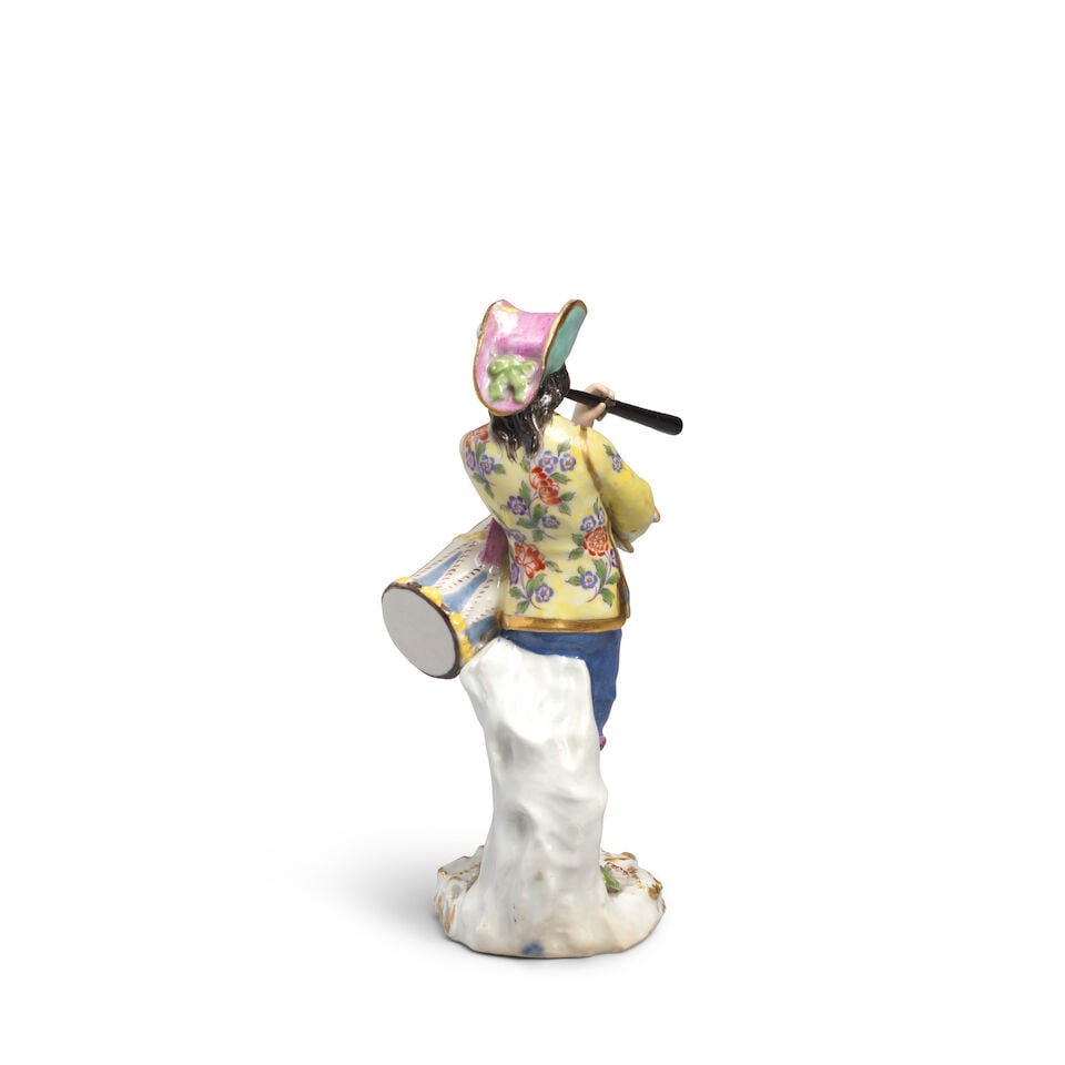 A Meissen later-decorated figure of a fife and drum player from the Cris de Paris series, the po... - 2