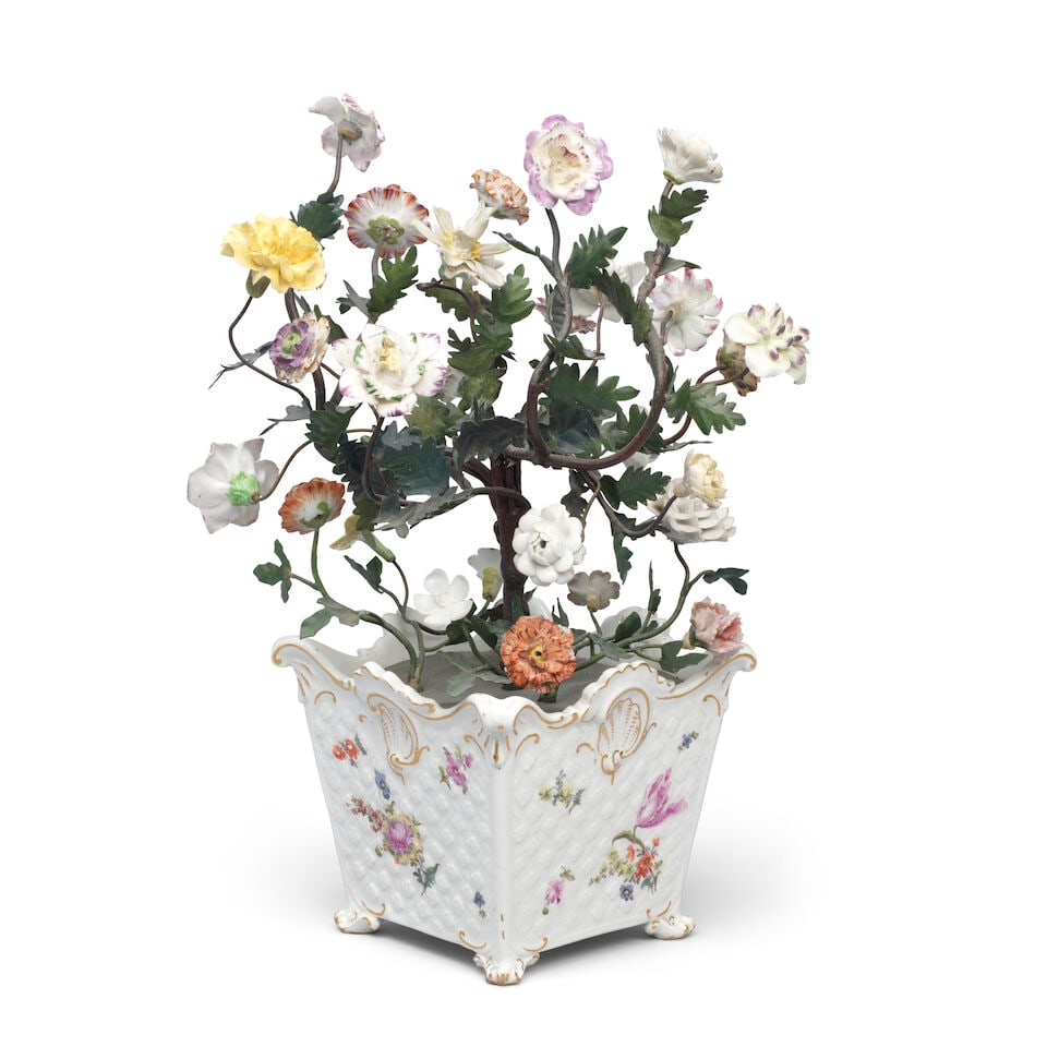 A Meissen cachepot, circa 1760, mounted with later flowers: A Meissen cachepot, circa 1760, mounted with later flowers Moulded with a basketwork pattern enclosing flowerheads and edged with shell- and scrollwork heightened in gilding, painted with scattered