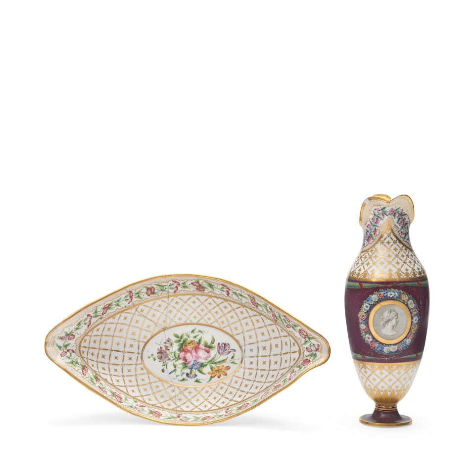 A Sèvres maroon-ground ewer and basin (pot à l'eau et jatte forme nacelle), circa 1793: A Sèvres maroon-ground ewer and basin (pot à l'eau et jatte forme nacelle), circa 1793 Painted by Nicolas Bulidon with flower wreaths enclosing flower sprays, the interior of the basin with