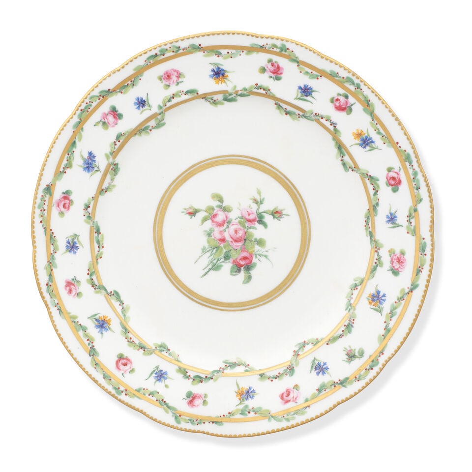 A Sèvres plate from a service for the duc de Chartres, dated 1775: A Sèvres plate from a service for the duc de Chartres, dated 1775 Painted by Antoine-Joseph Chappuis (le jeune) with roses in the well surrounded by circular gilt lines, the rim border with rose 