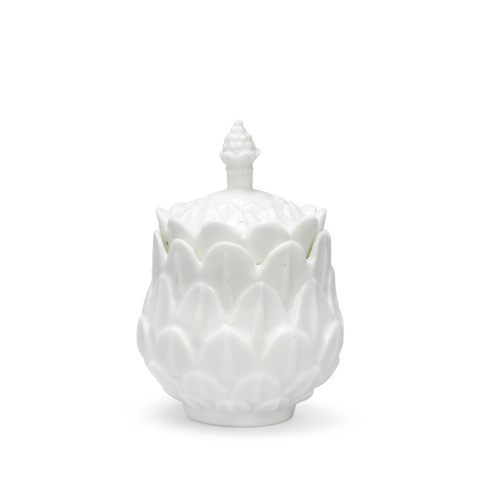 A Saint-Cloud white artichoke-moulded pomade pot and cover, circa 1735-40: A Saint-Cloud white artichoke-moulded pomade pot and cover, circa 1735-40 Moulded with graduating leaves, 10.2cm high (2) Footnotes: Provenance: With W W Warner, July 2012; John E Bodie OBE