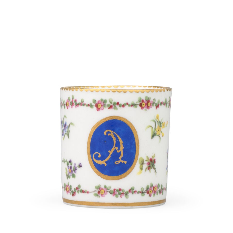 A Sèvres cup (gobelet litron) with initial 'A', dated 1784: A Sèvres cup (gobelet litron) with initial 'A', dated 1784 Of the third size, painted by Mme Gérard, with a blue-ground medallion enclosing a gilt scrollwork 'A', surrounded by sprays of