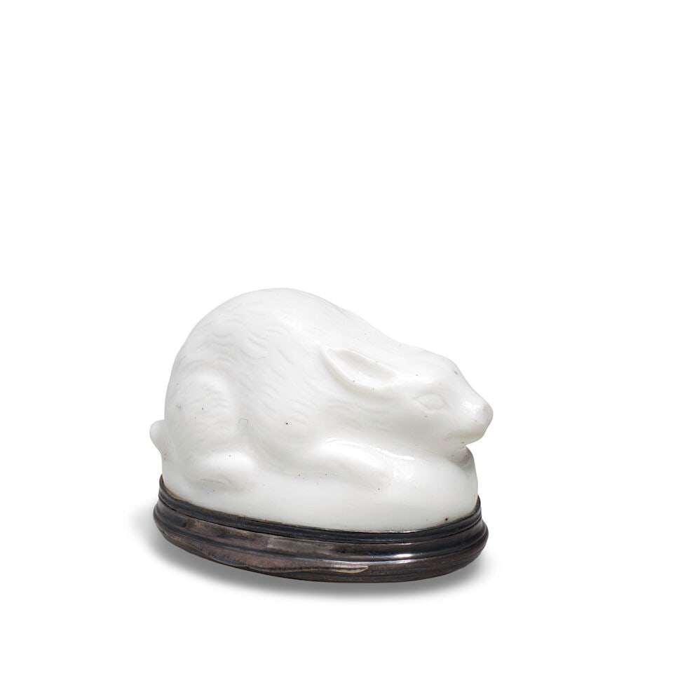 A Mennecy silver-mounted white patch box modelled as a rabbit, circa 1735: A Mennecy silver-mounted white patch box modelled as a rabbit, circa 1735 Naturalistically modelled, the cover moulded with a foliate spray, the silver mount with a Paris discharge mark for 1750-56,
