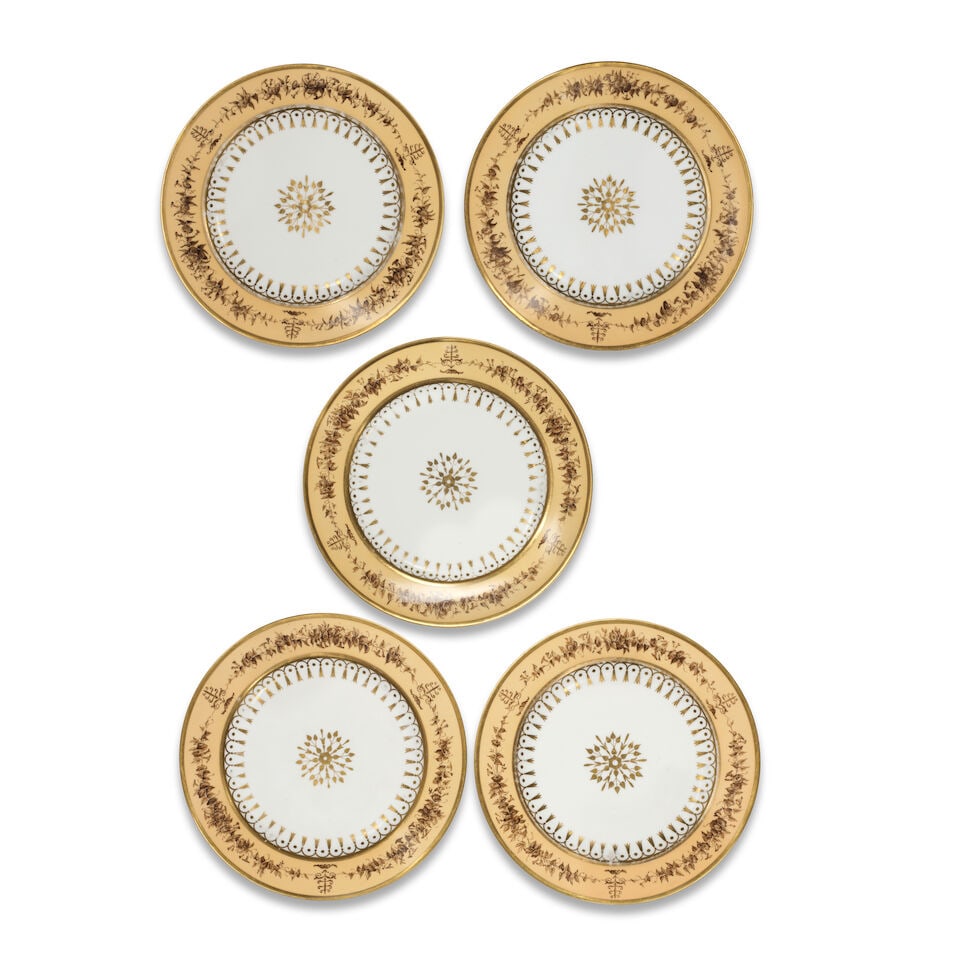 Five Sèvres 'fond nankin' plates, dated 1812: Five Sèvres 'fond nankin' plates, dated 1812 Each rim with a dark yellow ground, painted with a brown border of volubilis and palmettes heightened with white details, the well decorated with a gi