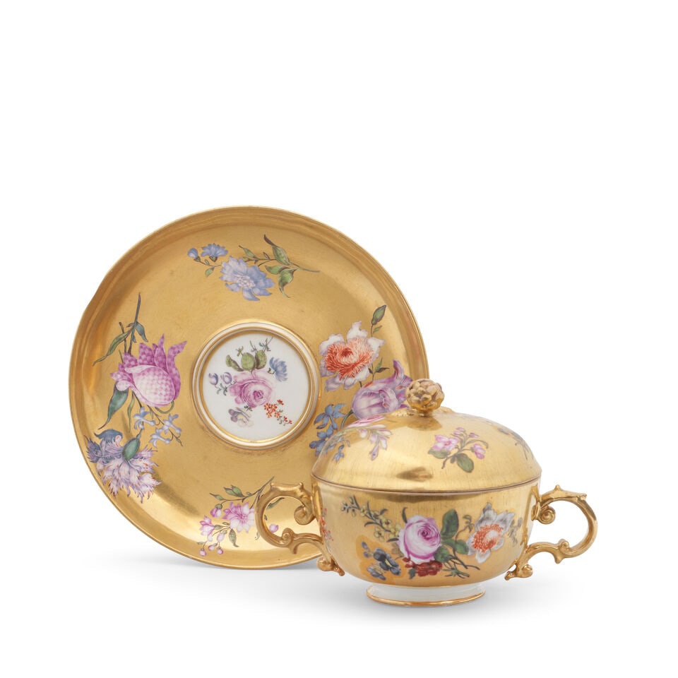 A Meissen gold-ground two-handled ecuelle, cover and stand, first half 19th century: A Meissen gold-ground two-handled ecuelle, cover and stand, first half 19th century Painted with scattered flower sprigs reserved against the gold ground, the handles and flower finial gilt, the