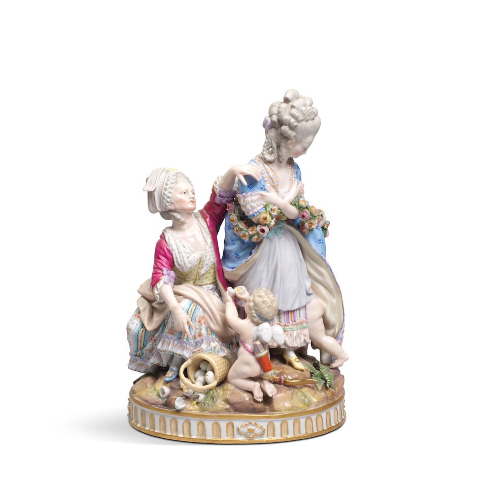 A Meissen group of 'The Broken Eggs', late 19th century: A Meissen group of 'The Broken Eggs', late 19th century After the model by M.V. Acier of 1777, depicting two ladies, one turning away, the other seated reaching up to the first and pointing to a