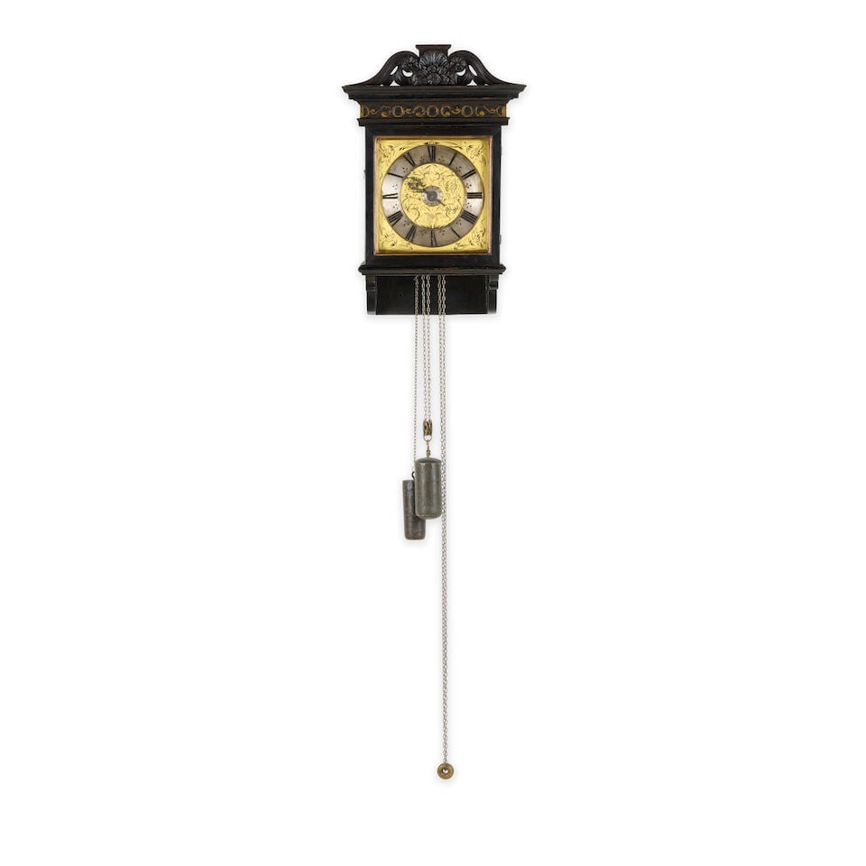 A hooded wall clock, 17th century and later Jonathan Lowndes, London: A hooded wall clock, 17th century and later Jonathan Lowndes, London The later custom-made wooden case with carved cresting to the top over a flat moulded hood with blind-carved frieze with blind gilt
