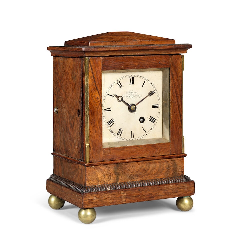 A late 19th century mahogany library clock timepiece Allport, Knightsbridge: A late 19th century mahogany library clock timepiece Allport, Knightsbridge The sloped top over a moulded decoration with simple brass banding to the sides terminating in a decorated plinth and