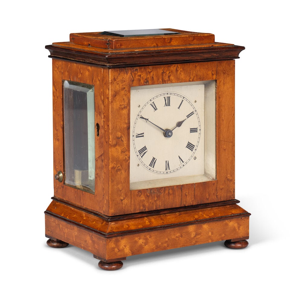 A late 19th century burr maple library clock timepiece French, Royal Exchange, London: A late 19th century burr maple library clock timepiece French, Royal Exchange, London The case surmounted by a bevelled glass observation window over a moulded top, the sides with further observation 